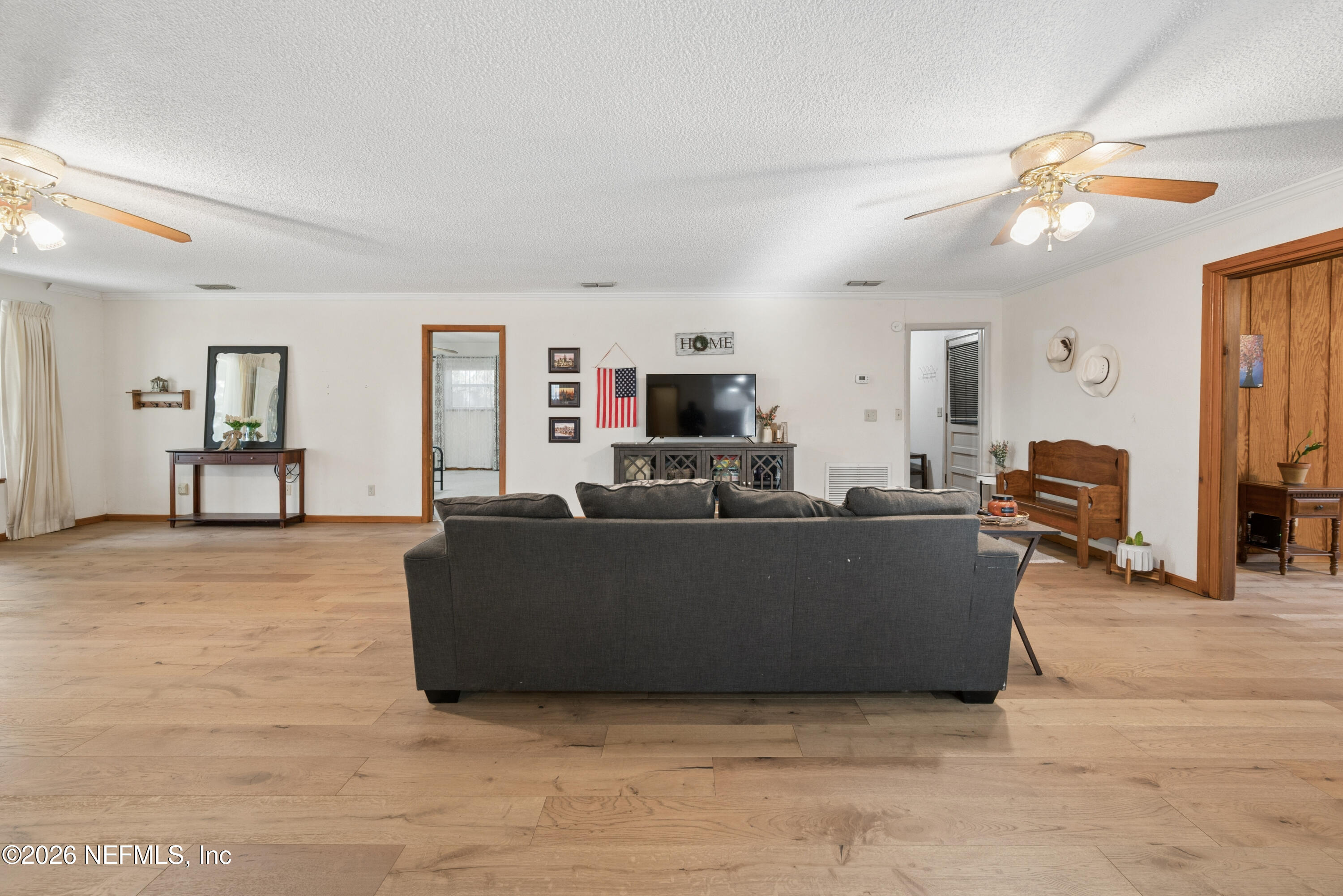 20021 Southeast 88th Trail Lake Butler, FL 32054 - Photo 22 of 43 a living room with furniture and a flat screen tv