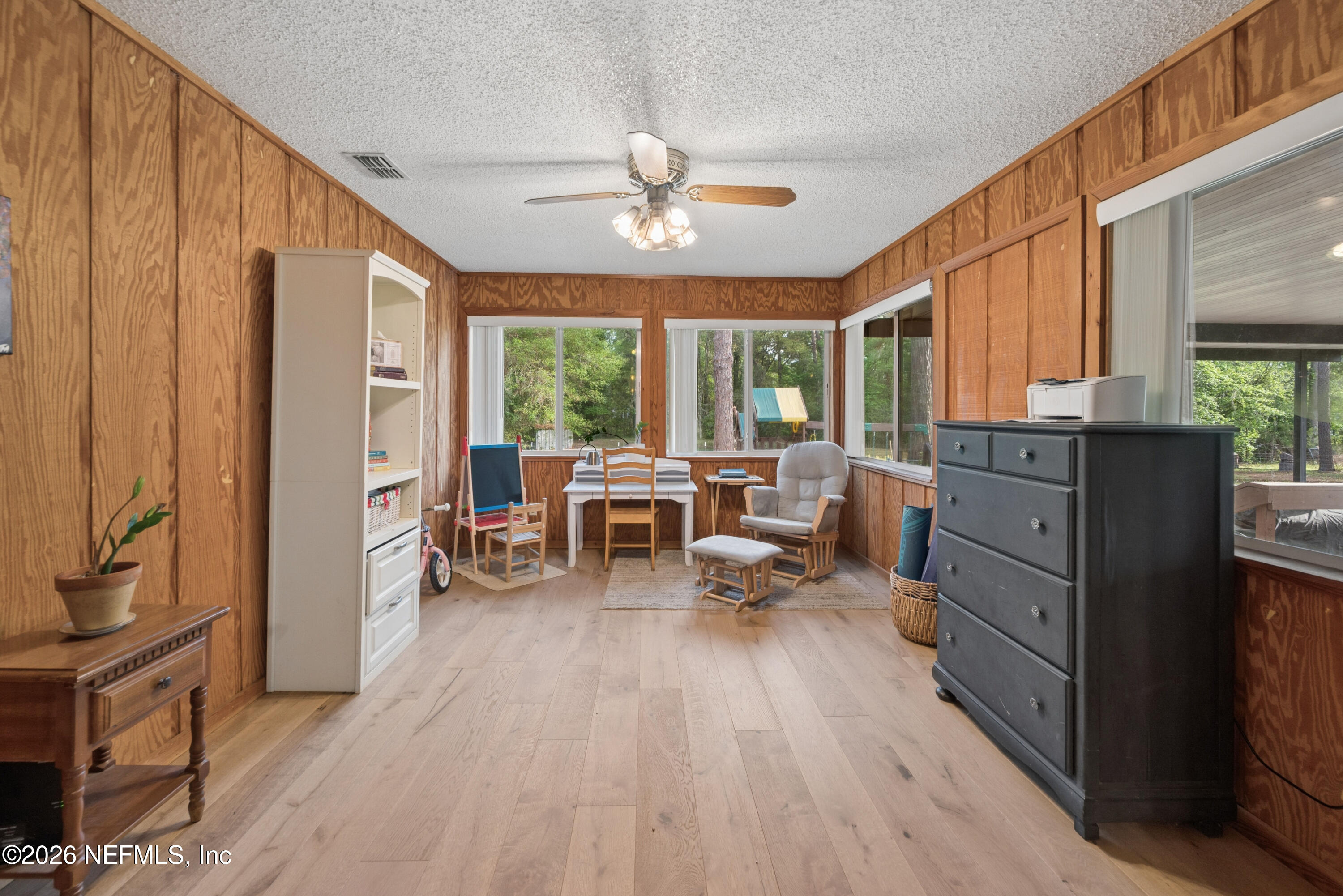 20021 Southeast 88th Trail Lake Butler, FL 32054 - Photo 29 of 43 a living room with furniture and large windows