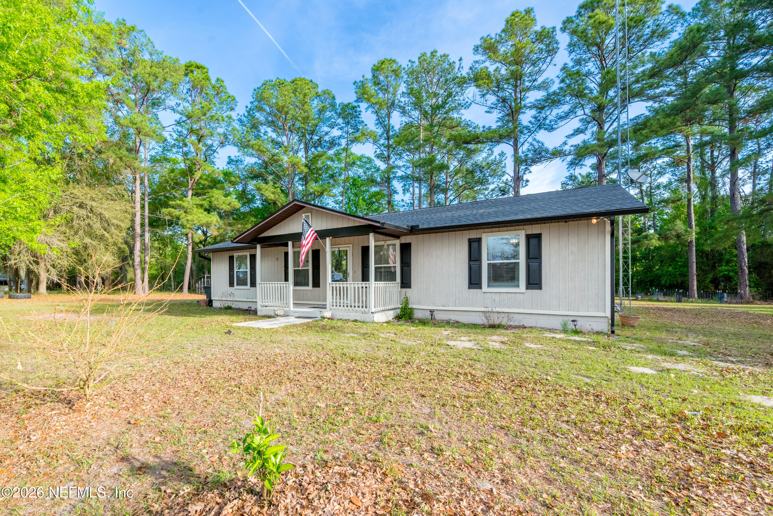 20021 Southeast 88th Trail Lake Butler, FL 32054 - Photo 3 of 43 a front view of a house with a garden