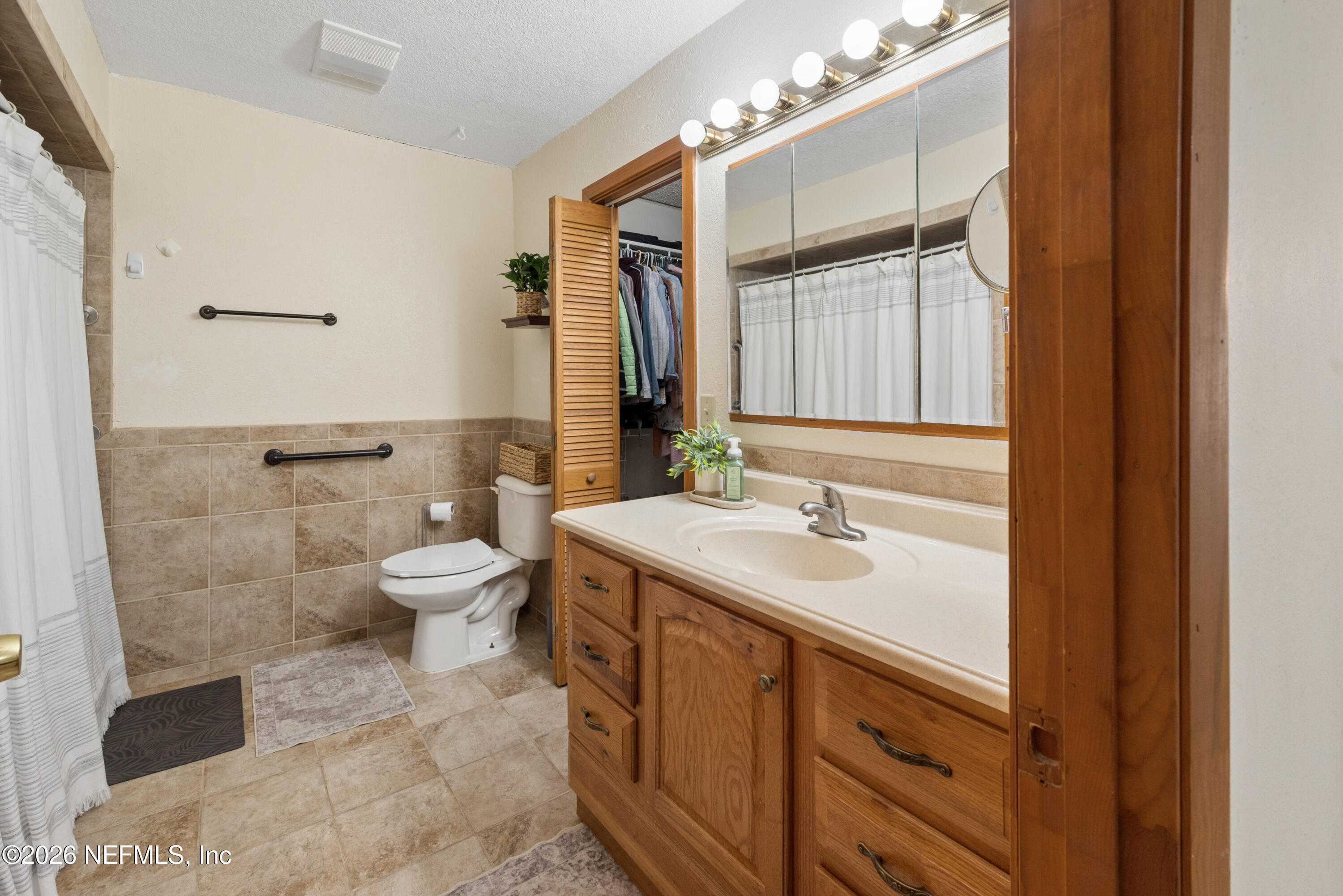 20021 Southeast 88th Trail Lake Butler, FL 32054 - Photo 36 of 43 a bathroom with a sink toilet and shower