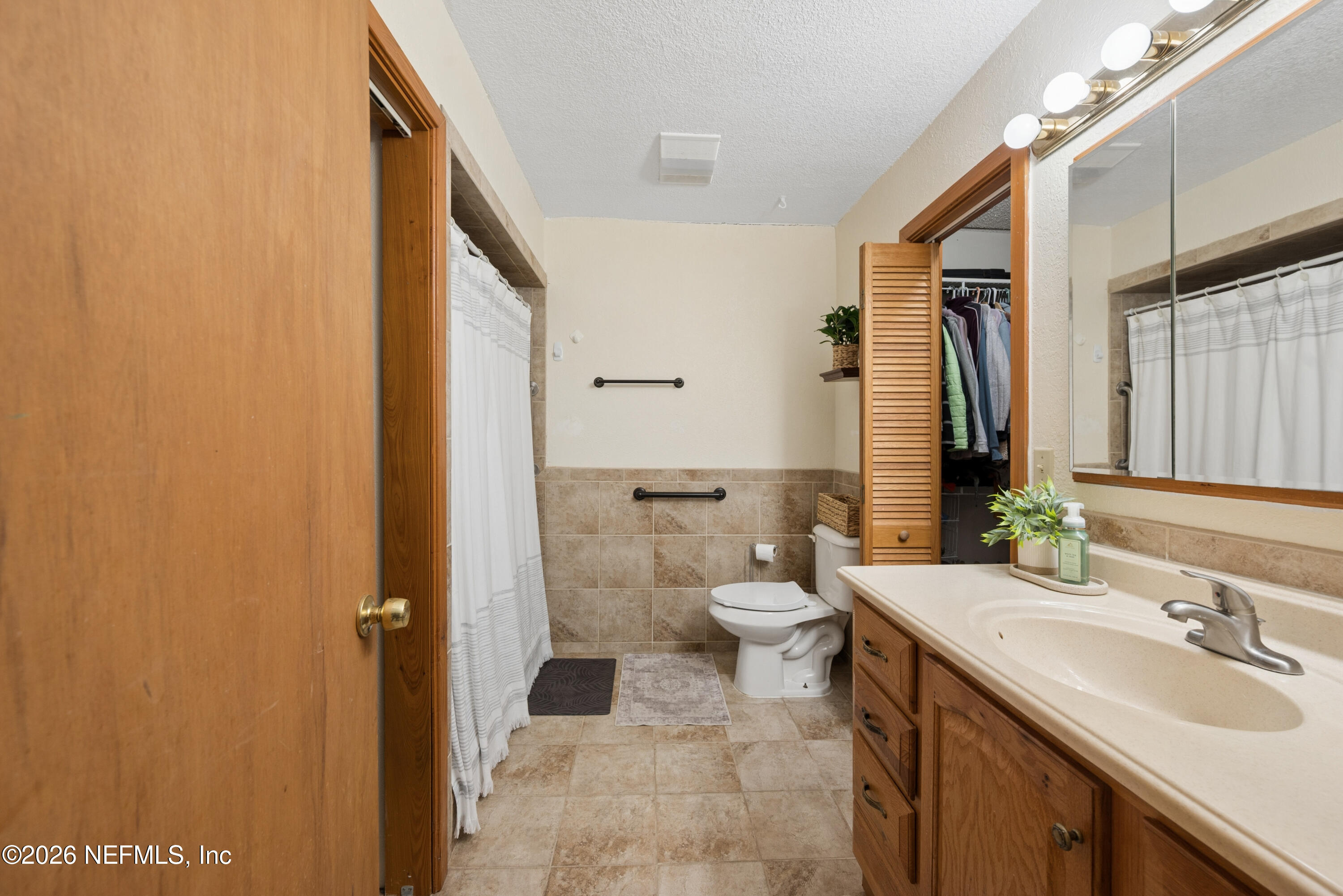 20021 Southeast 88th Trail Lake Butler, FL 32054 - Photo 40 of 43 a bathroom with a sink a toilet and shower