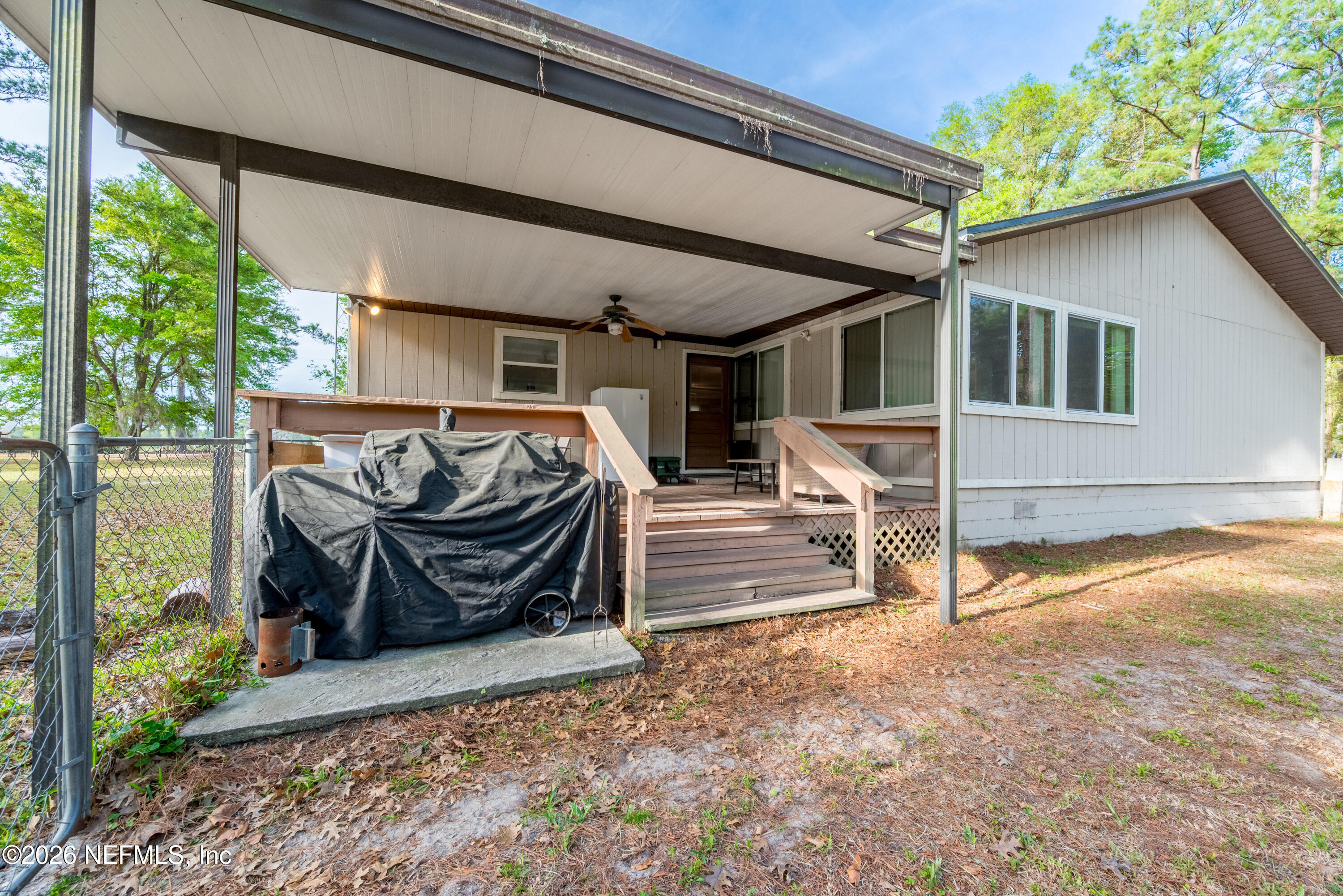 20021 Southeast 88th Trail Lake Butler, FL 32054 - Photo 6 of 43 a view of a two chairs in the patio
