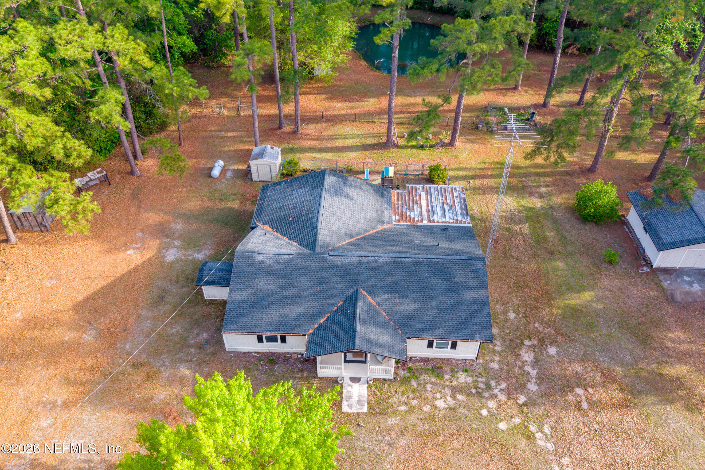 20021 Southeast 88th Trail Lake Butler, FL 32054 - Photo 8 of 43 a view of a patio with table and chairs potted plants