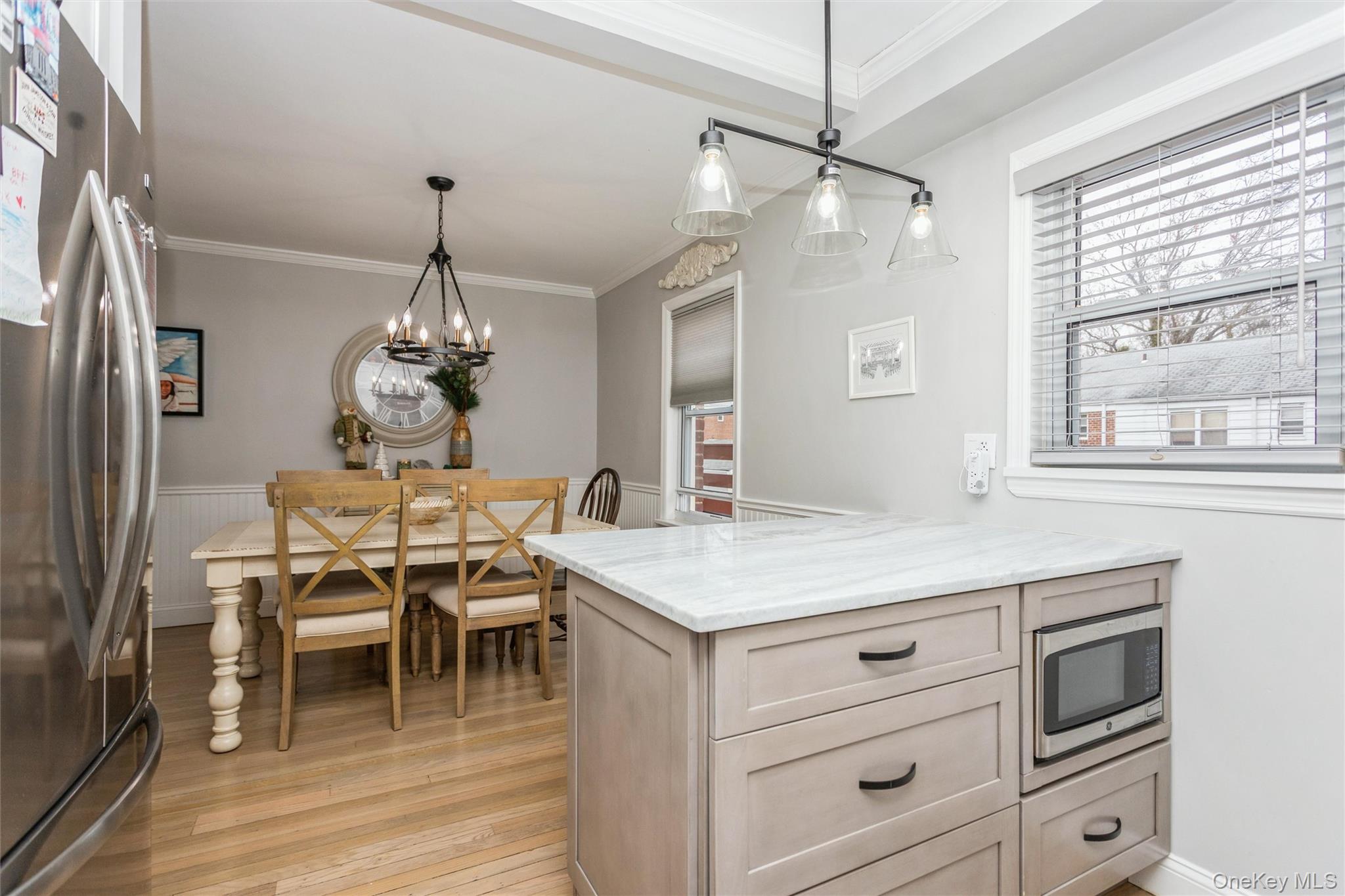 5 Peck Avenue, Unit 51B Rye, NY 10580 - Photo 13 of 31 a view of a dining room with furniture window and wooden floor