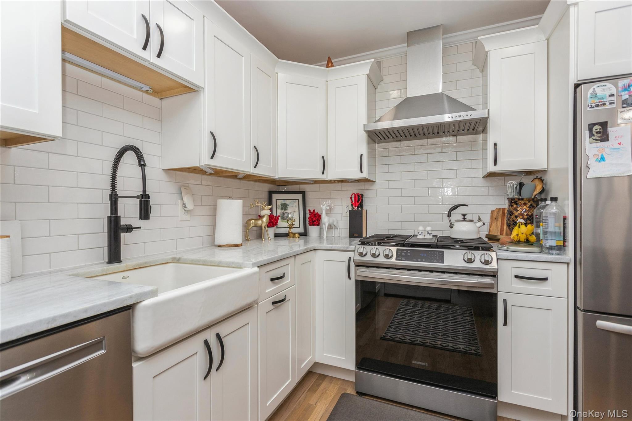 5 Peck Avenue, Unit 51B Rye, NY 10580 - Photo 14 of 31 a kitchen with cabinets a sink and a stove top oven