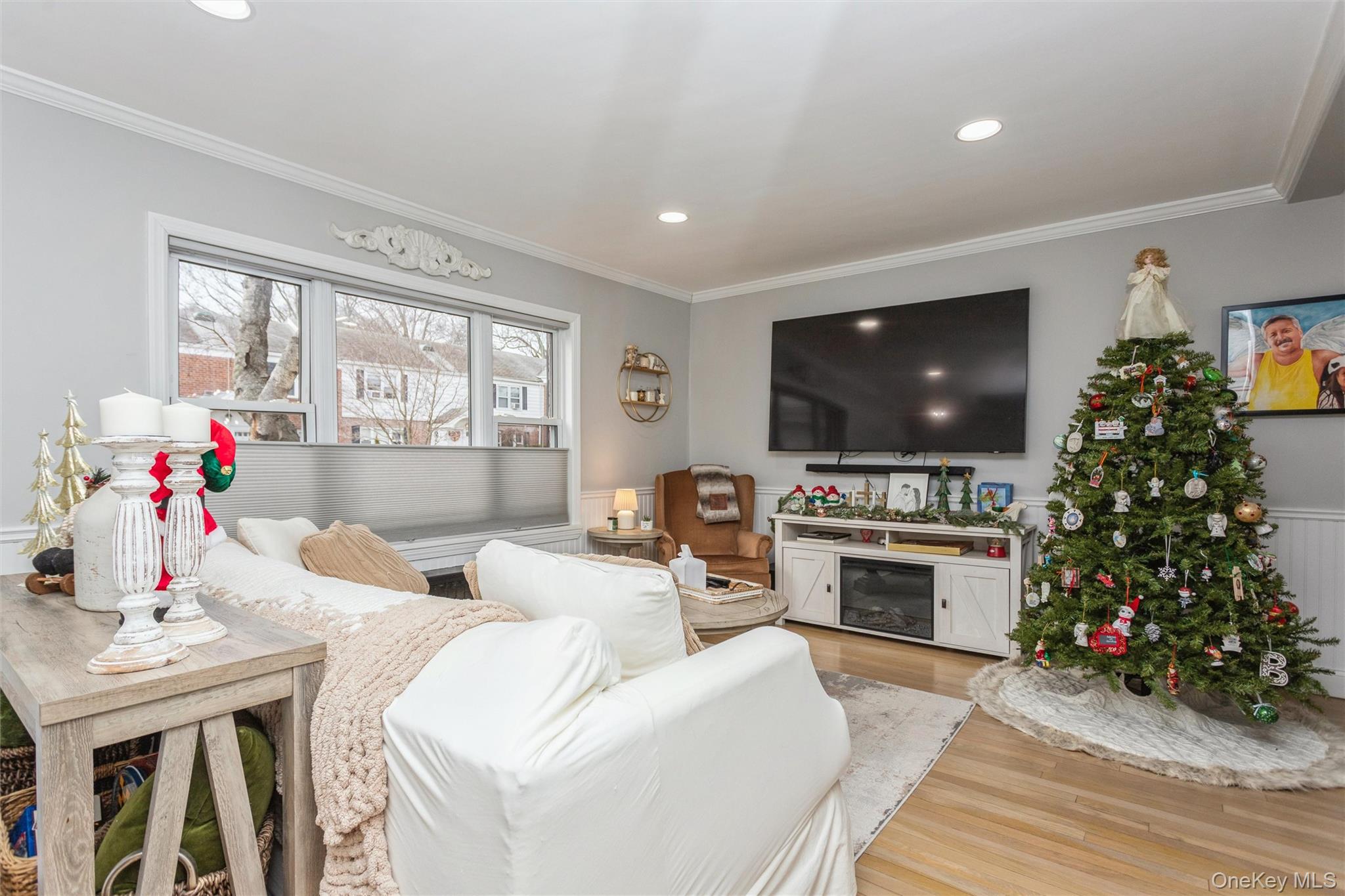 5 Peck Avenue, Unit 51B Rye, NY 10580 - Photo 17 of 31 a living room with furniture a flat screen tv and a fireplace