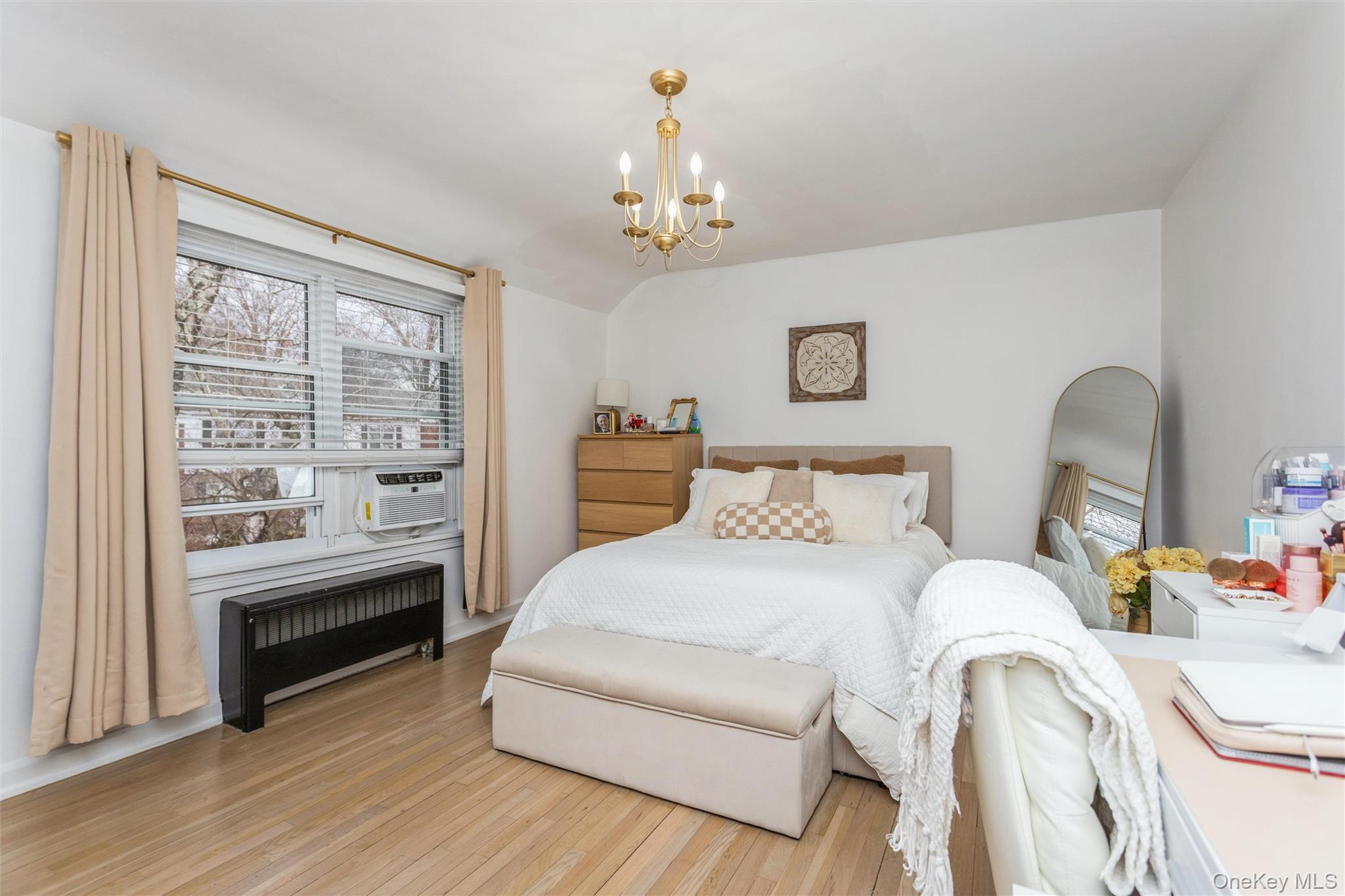5 Peck Avenue, Unit 51B Rye, NY 10580 - Photo 19 of 31 a bedroom with a bed wooden floor and window