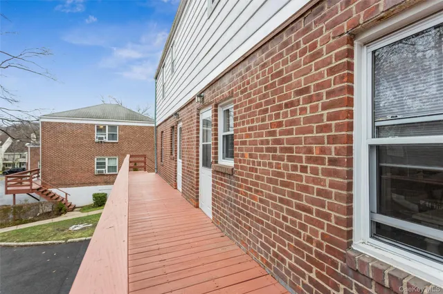 a front view of a building with outdoor space