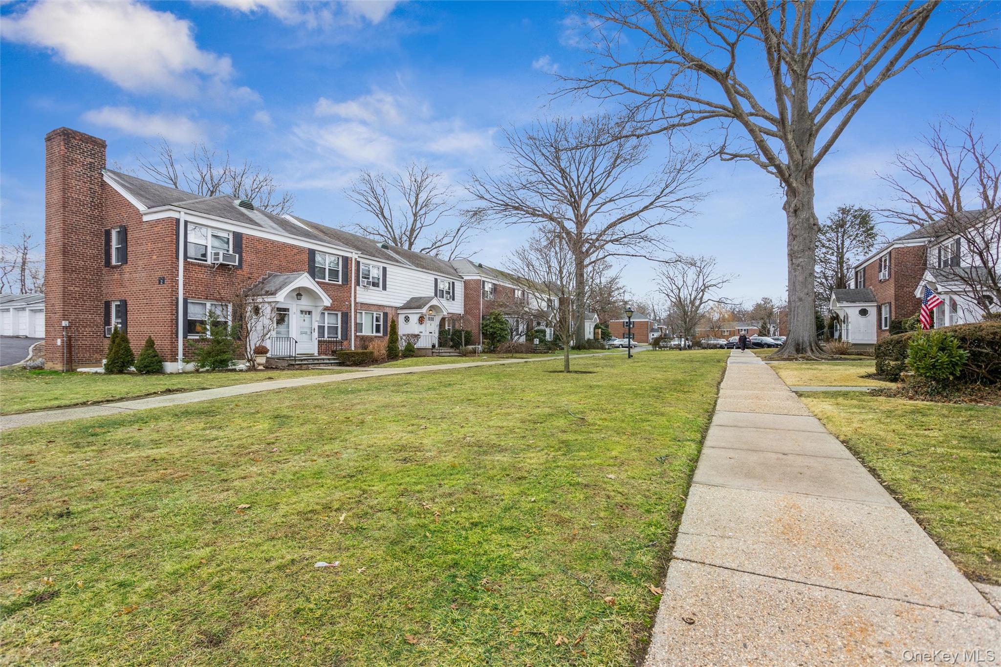 5 Peck Avenue, Unit 51B Rye, NY 10580 - Photo 27 of 31 a view of a park with large trees