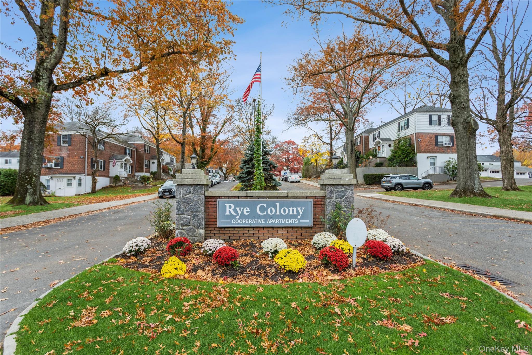 5 Peck Avenue, Unit 51B Rye, NY 10580 - Photo 28 of 31 a sign that is in front of flowers