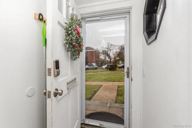 a view of a porch with a floor to ceiling window