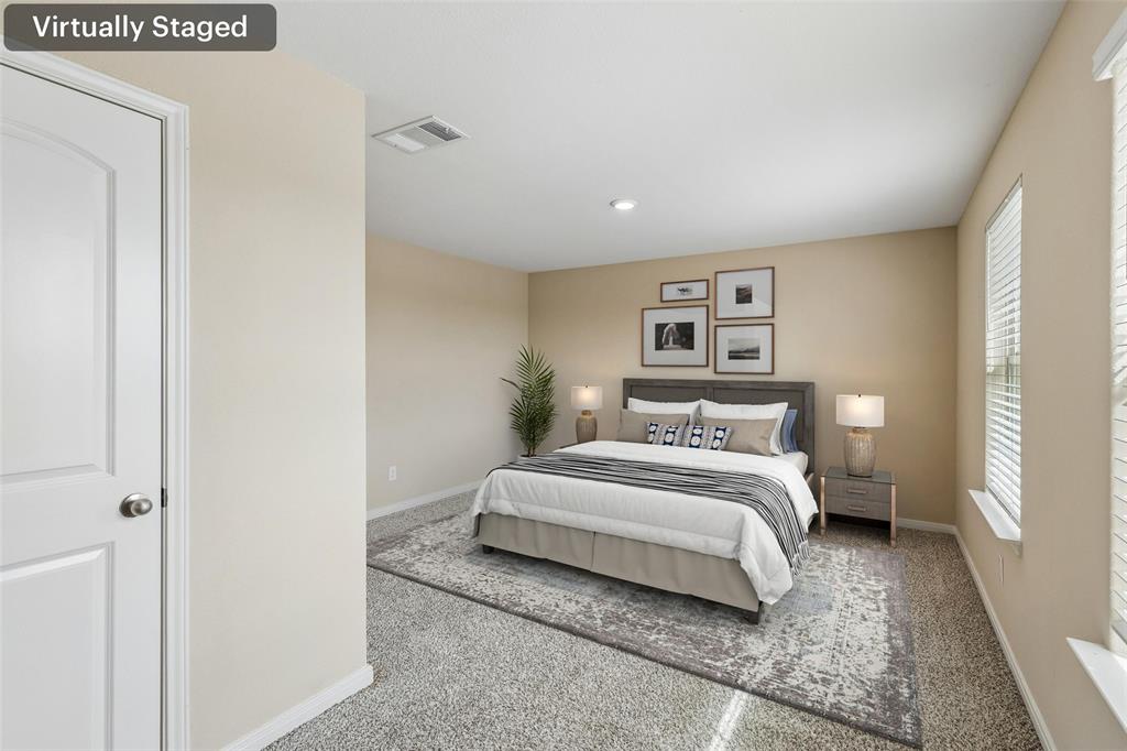 230 Enchanted Way Princeton, TX 75407 - Photo 11 of 31 a bedroom with a bed and a painting on the wall