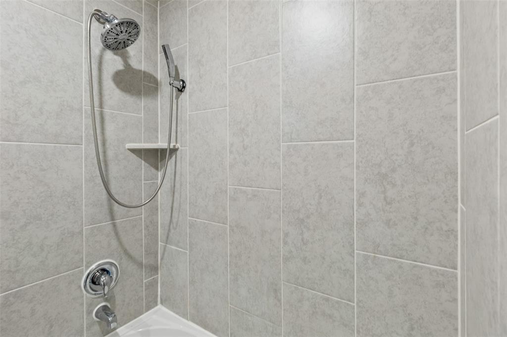 230 Enchanted Way Princeton, TX 75407 - Photo 14 of 31 a bathroom with a shower