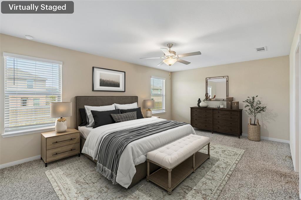 230 Enchanted Way Princeton, TX 75407 - Photo 17 of 31 a bedroom with a bed and a chandelier