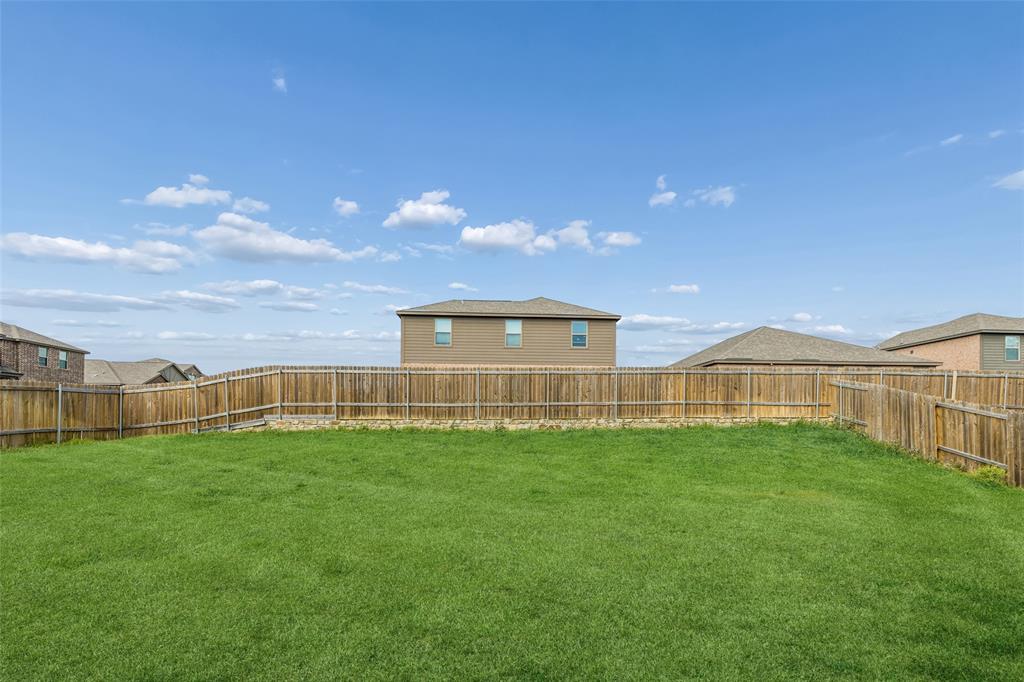 230 Enchanted Way Princeton, TX 75407 - Photo 23 of 31 a view of a yard in front of a house