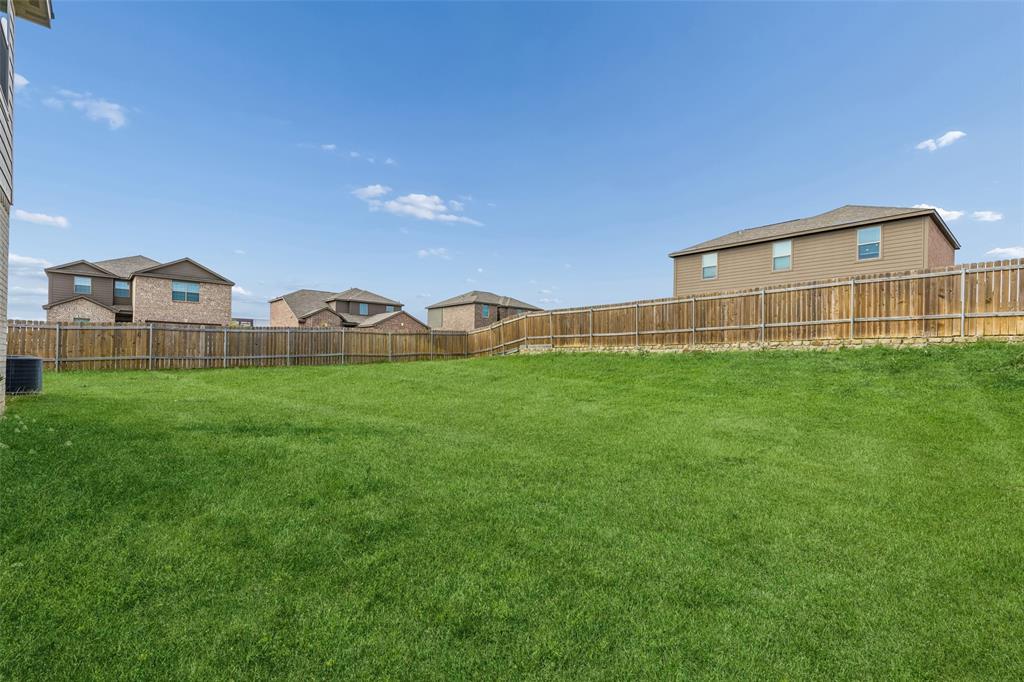 230 Enchanted Way Princeton, TX 75407 - Photo 24 of 31 a view of a back yard of the house