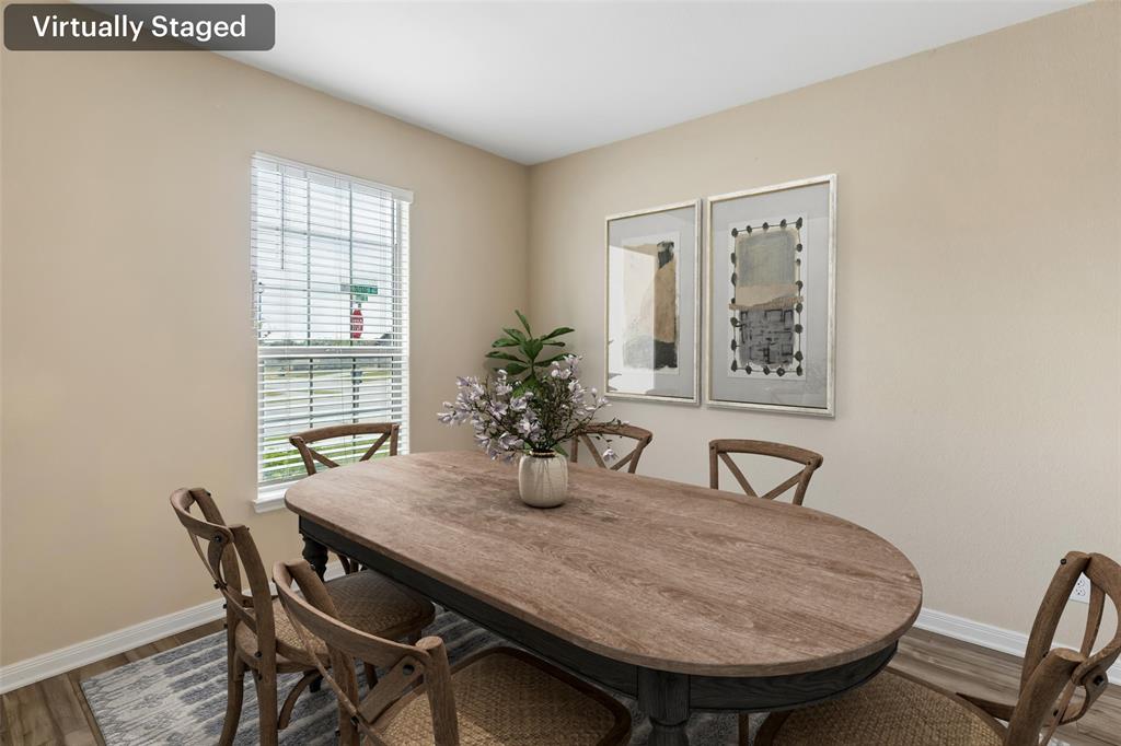 230 Enchanted Way Princeton, TX 75407 - Photo 3 of 31 a view of a dining room with furniture and window