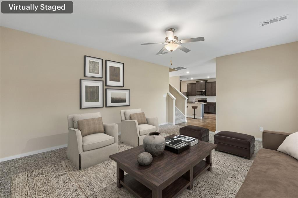 230 Enchanted Way Princeton, TX 75407 - Photo 8 of 31 a living room with furniture a chandelier and a window