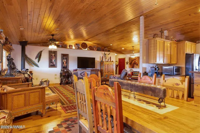 a dining room with furniture and window