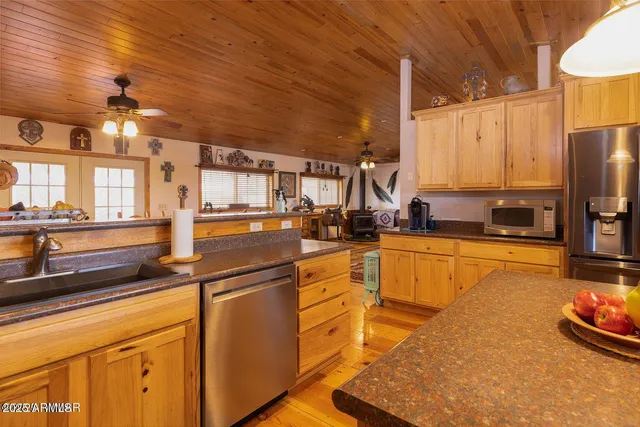 a stove top oven sitting inside of a kitchen
