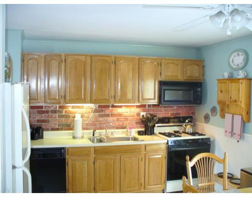 311 Ryan Road Northampton, MA 01062 - Photo 3 of 8 a kitchen with granite countertop a stove a sink and a microwave
