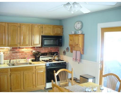 311 Ryan Road Northampton, MA 01062 - Photo 4 of 8 a kitchen with a sink cabinets and appliances