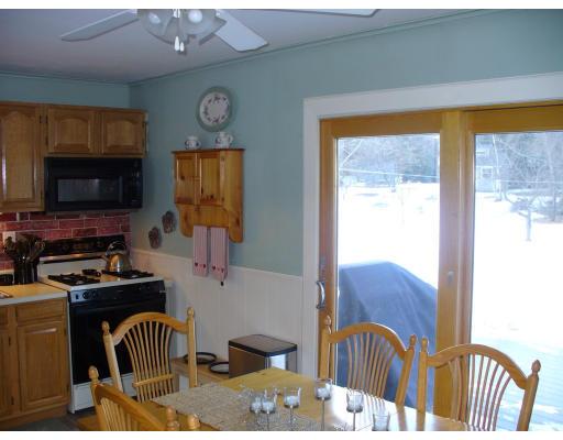311 Ryan Road Northampton, MA 01062 - Photo 5 of 8 a kitchen with furniture a flat screen tv and a window