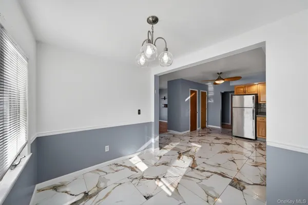 a view of a hallway with a chandelier