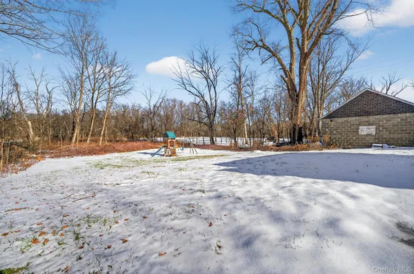 a front view of a house with a yard and glass windows