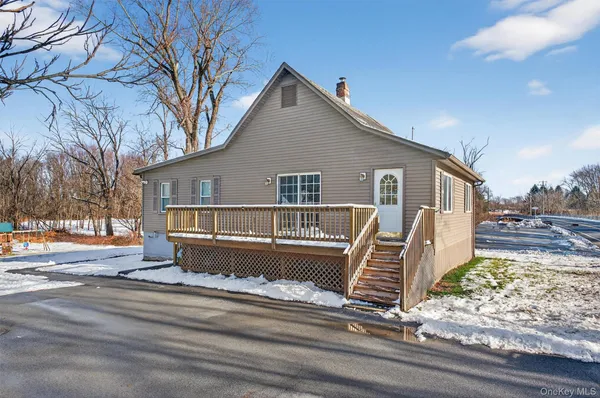 a front view of a house with a wooden fence
