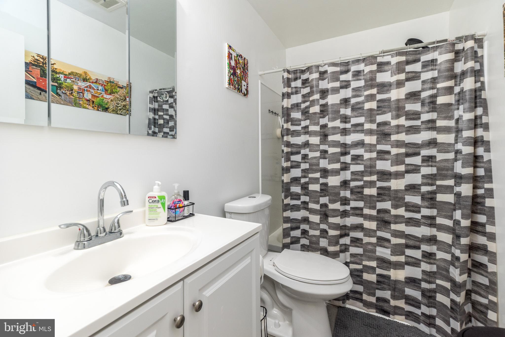403 South Main Street, Unit C202 Doylestown, PA 18901 - Photo 12 of 18 a bathroom with a sink and a toilet