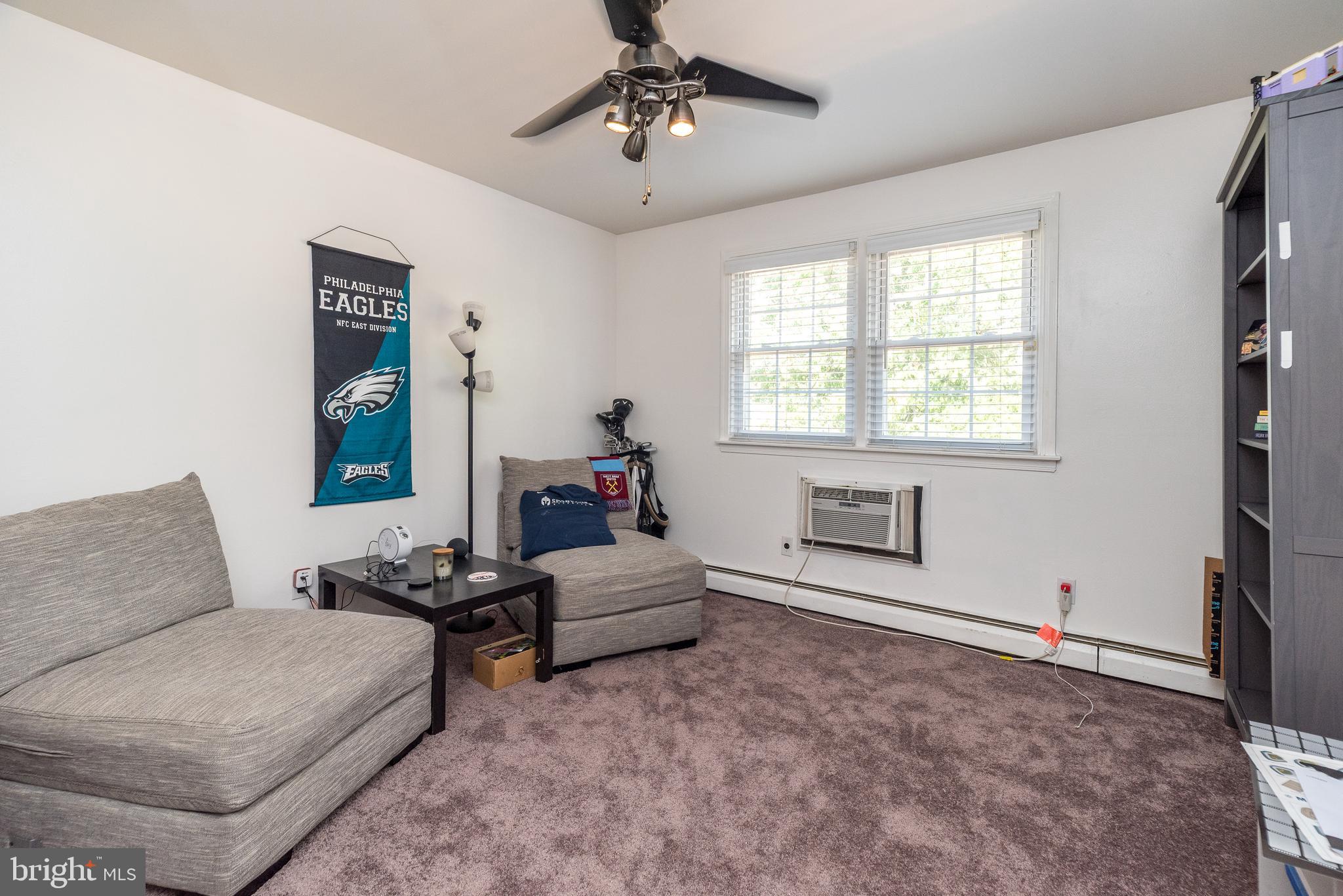 403 South Main Street, Unit C202 Doylestown, PA 18901 - Photo 16 of 18 a bedroom with furniture and a window