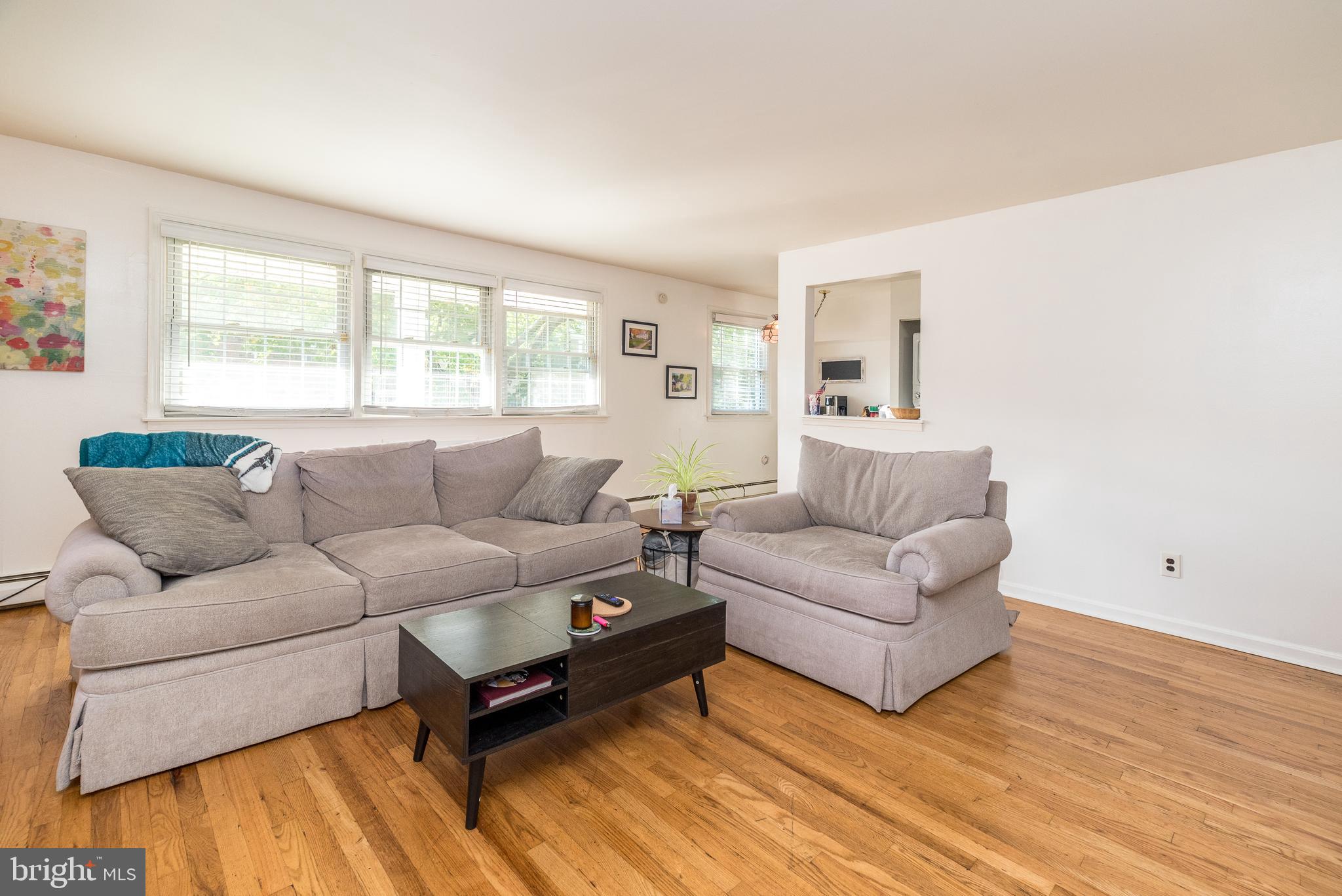 403 South Main Street, Unit C202 Doylestown, PA 18901 - Photo 3 of 18 a living room with furniture and a large window