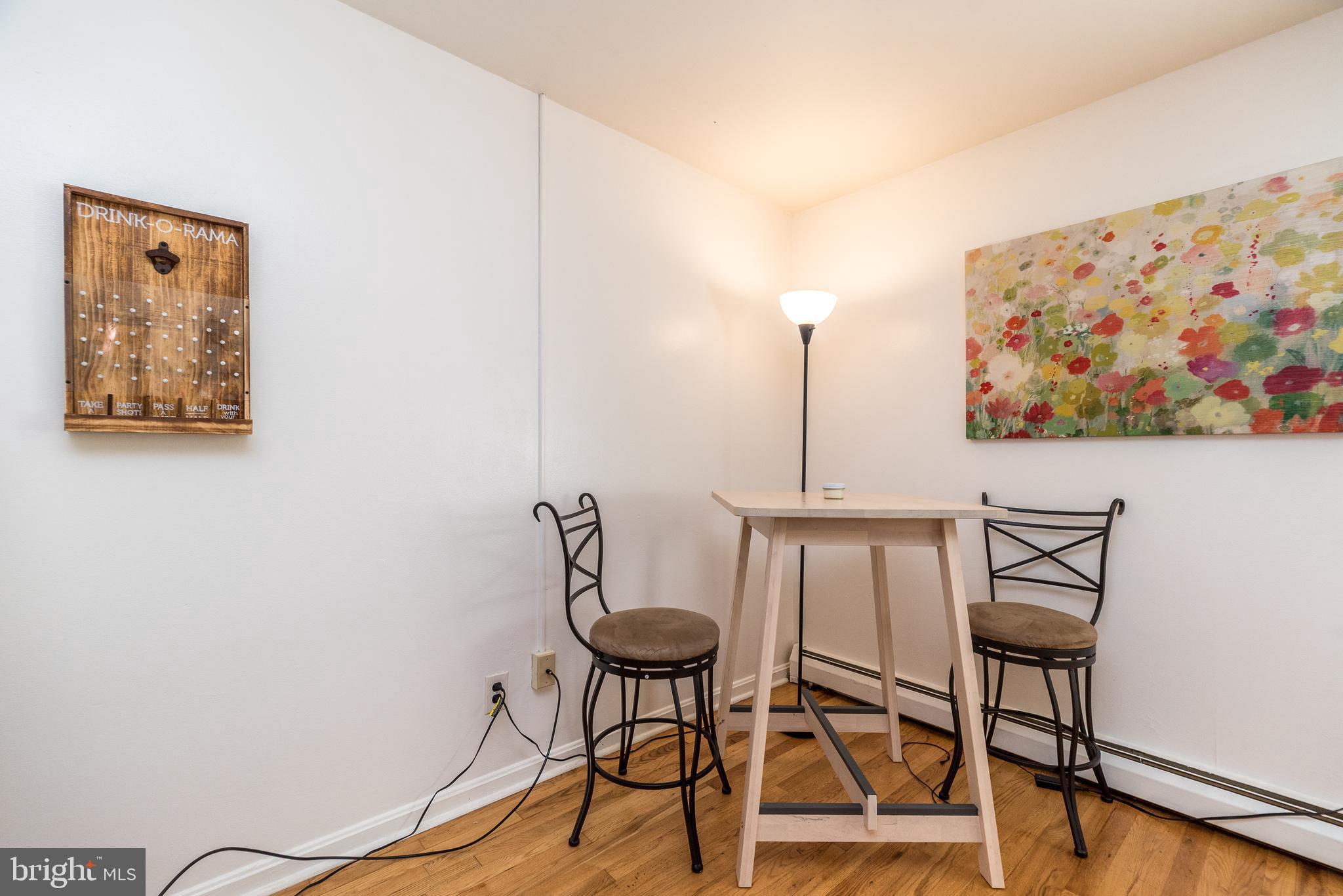 403 South Main Street, Unit C202 Doylestown, PA 18901 - Photo 4 of 18 a view of a room with a table and chairs
