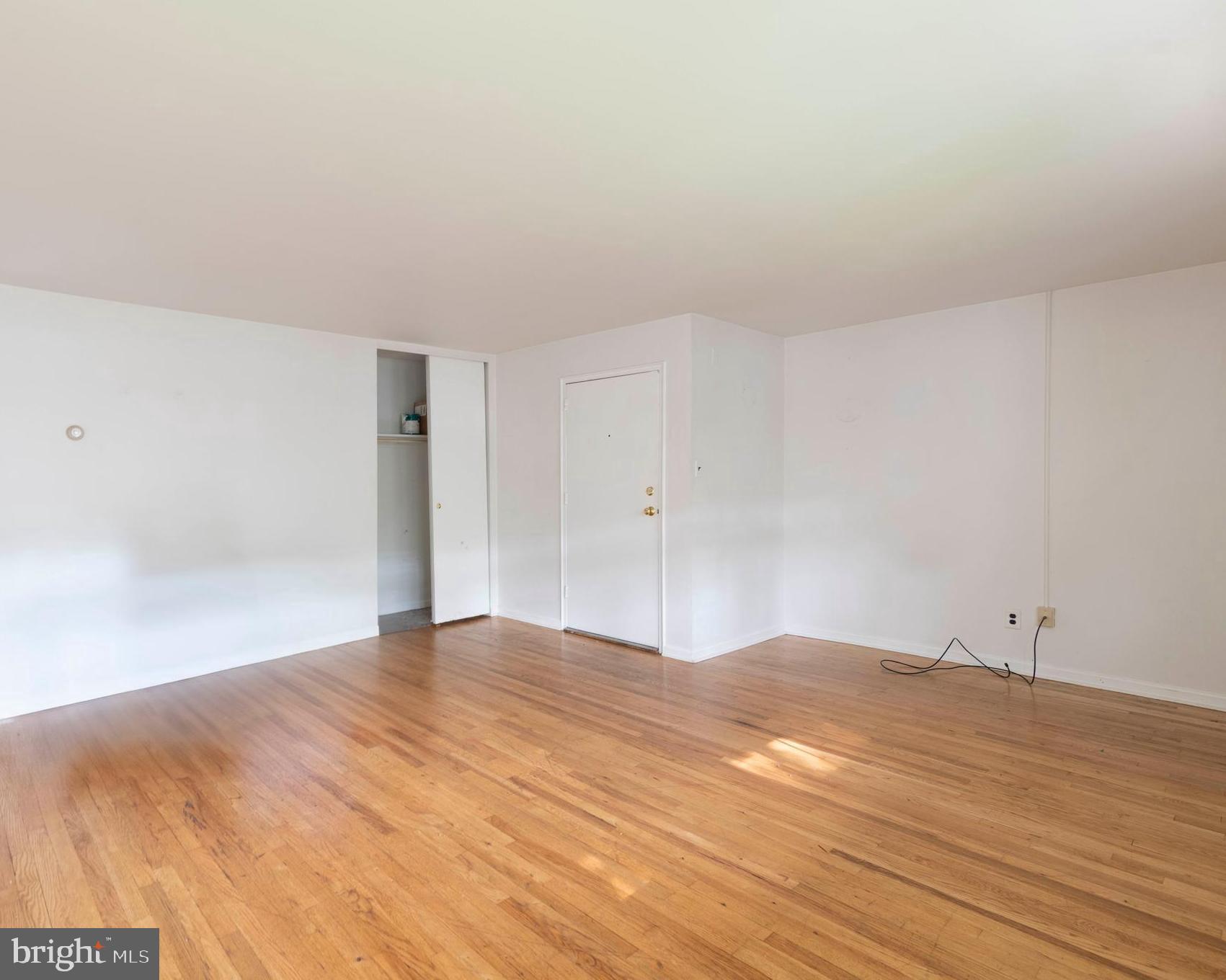 403 South Main Street, Unit C202 Doylestown, PA 18901 - Photo 5 of 18 a view of empty room with wooden floor