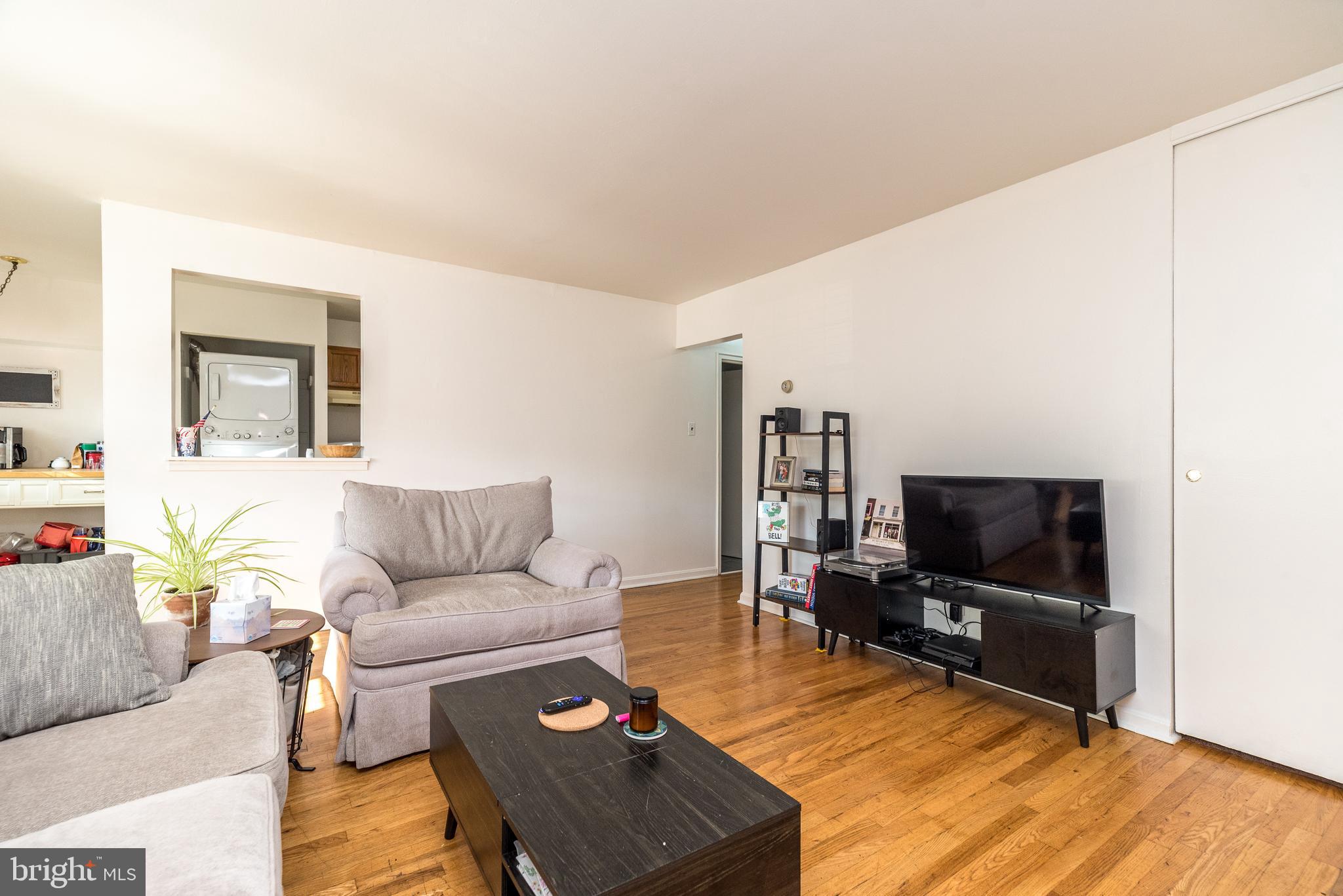 403 South Main Street, Unit C202 Doylestown, PA 18901 - Photo 6 of 18 a living room with furniture and a flat screen tv