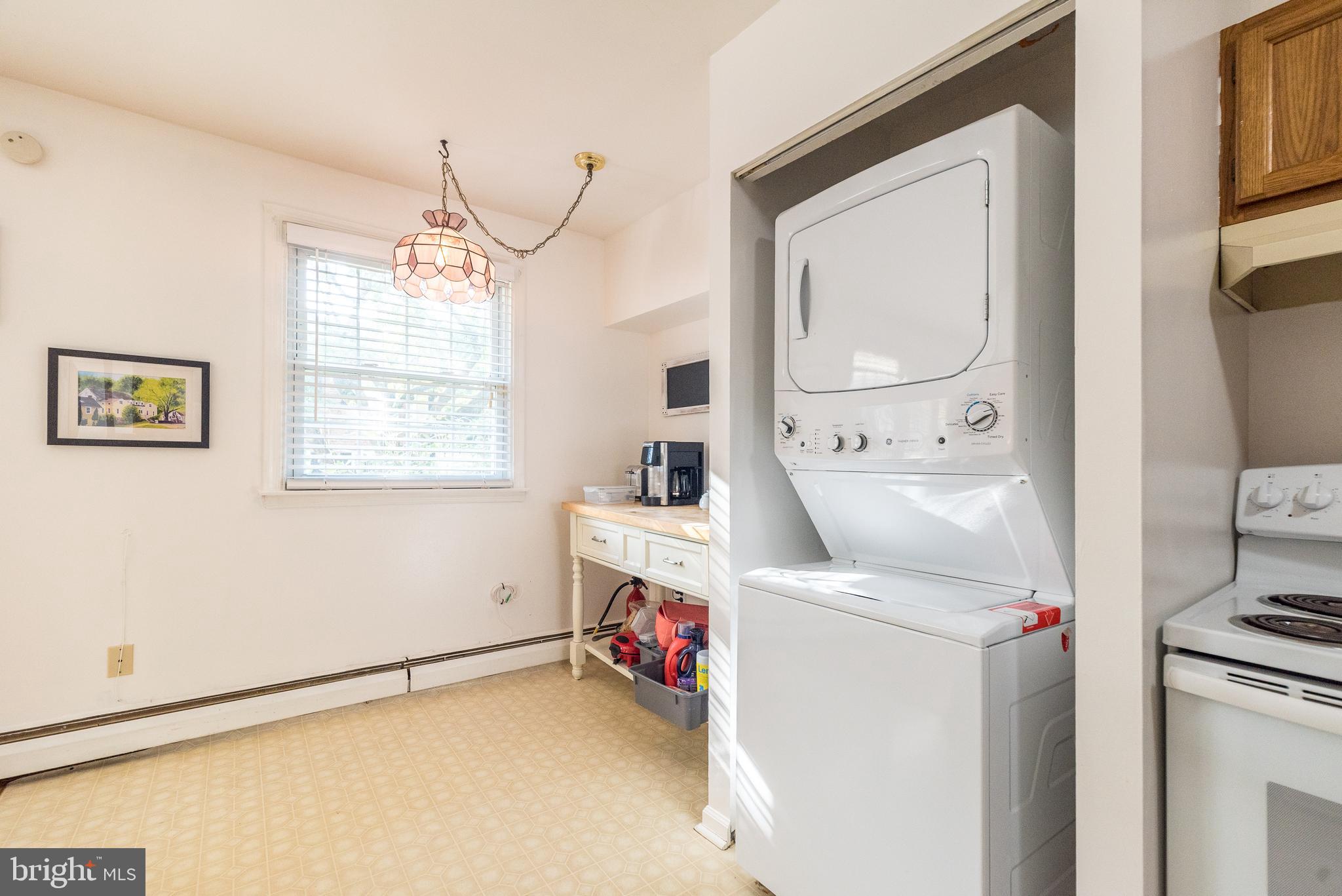 403 South Main Street, Unit C202 Doylestown, PA 18901 - Photo 10 of 18 a utility room with dryer washer and a window