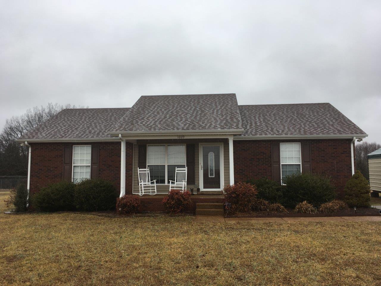 1009 Cameron Way Portland, TN 37148 - Photo 1 of 17 a front view of a house with garden