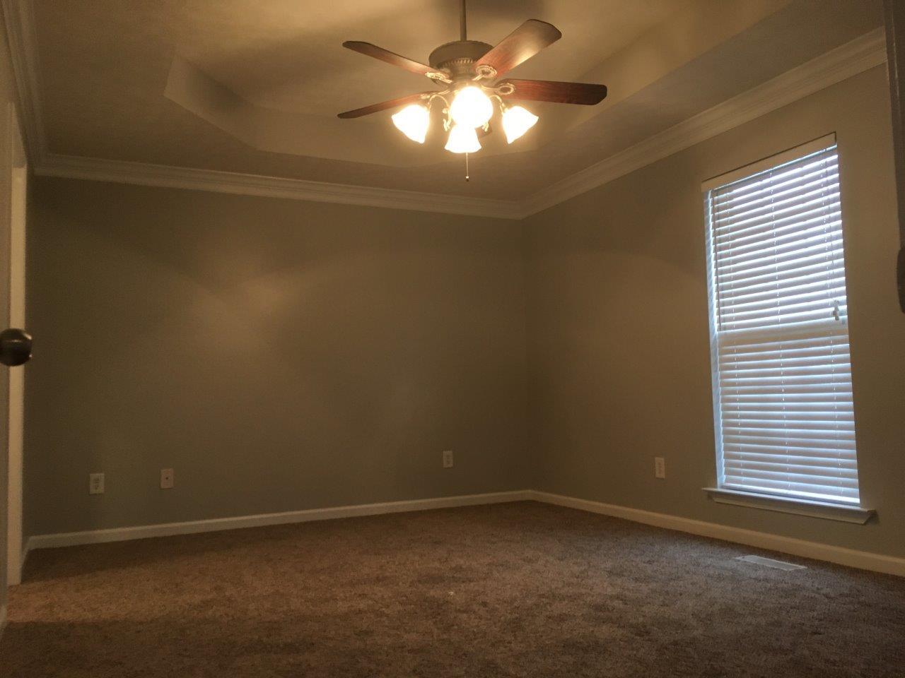 1009 Cameron Way Portland, TN 37148 - Photo 8 of 17 an empty room with a fan and a window