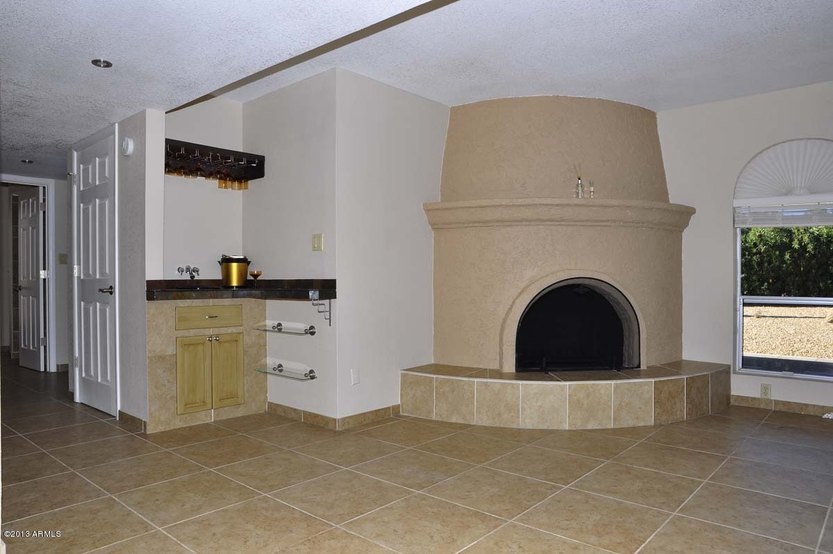 18607 East Mazatzal Circle Rio Verde, AZ 85263 - Photo 25 of 38 Fireplace-Wet Bar