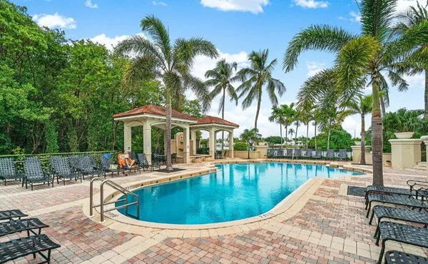 a view of a swimming pool with chairs