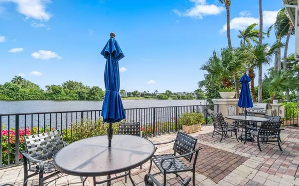 a table and chairs with the view of balcony