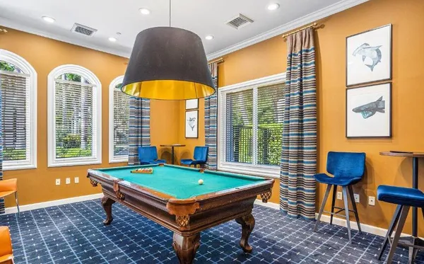 a room with furniture pool table and a table