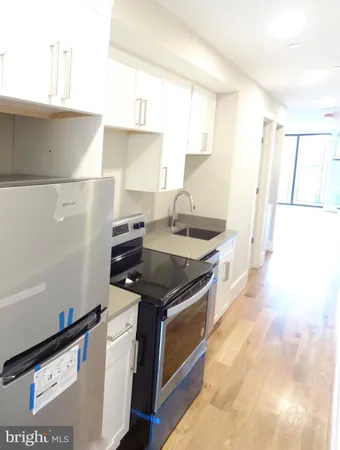 a kitchen with stainless steel appliances granite countertop a stove and a sink