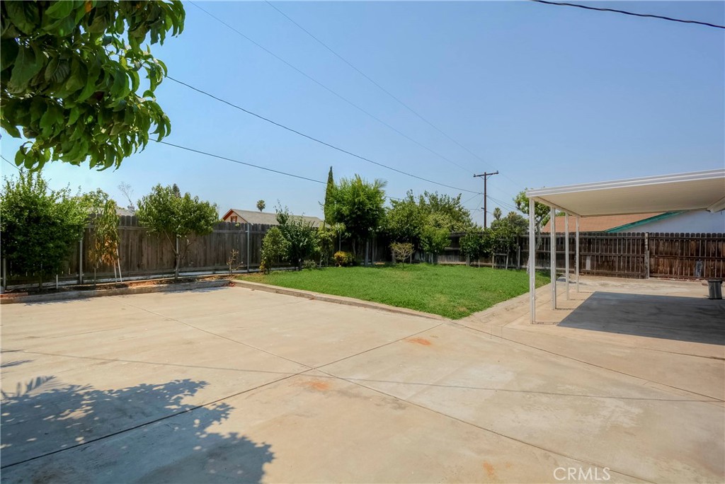 3446 Briarvale Street Corona, CA 92879 - Photo 30 of 37 a view of backyard with swimming pool and green space
