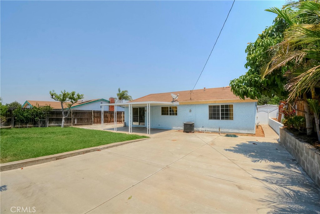 3446 Briarvale Street Corona, CA 92879 - Photo 31 of 37 a front view of a house with a yard and garage