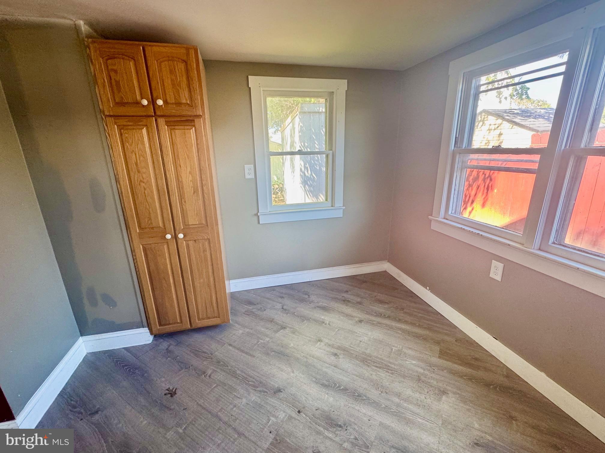 121 Jane Street Pemberton, NJ 08068 - Photo 7 of 21 an empty room with wooden floor and windows