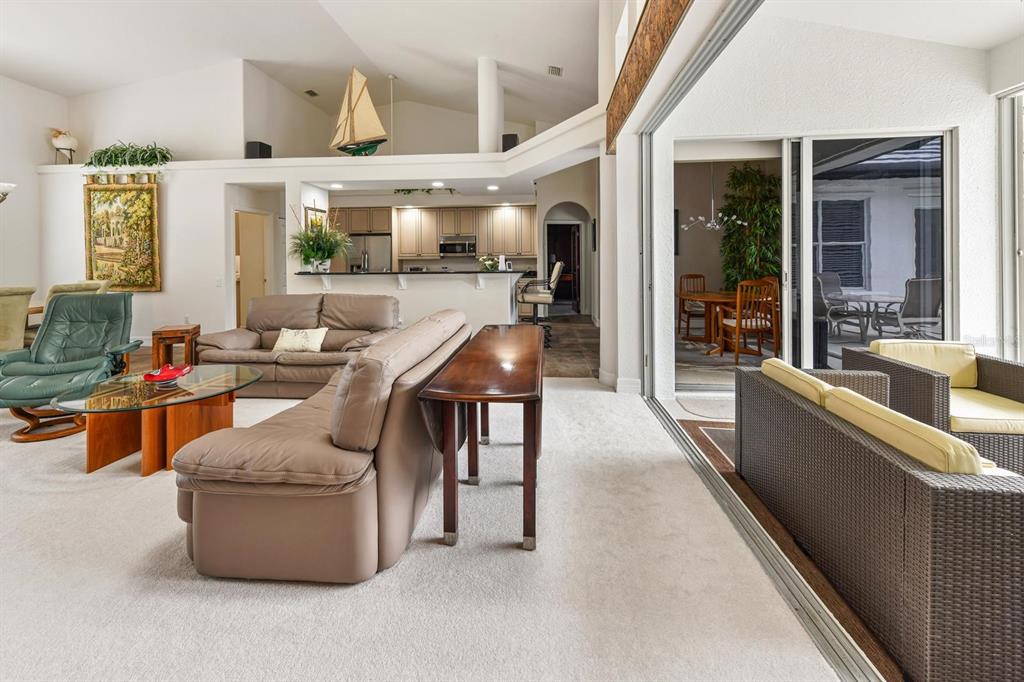 3267 Sugarloaf Key Road Punta Gorda, FL 33955 - Photo 23 of 83 a living room with furniture and a large window