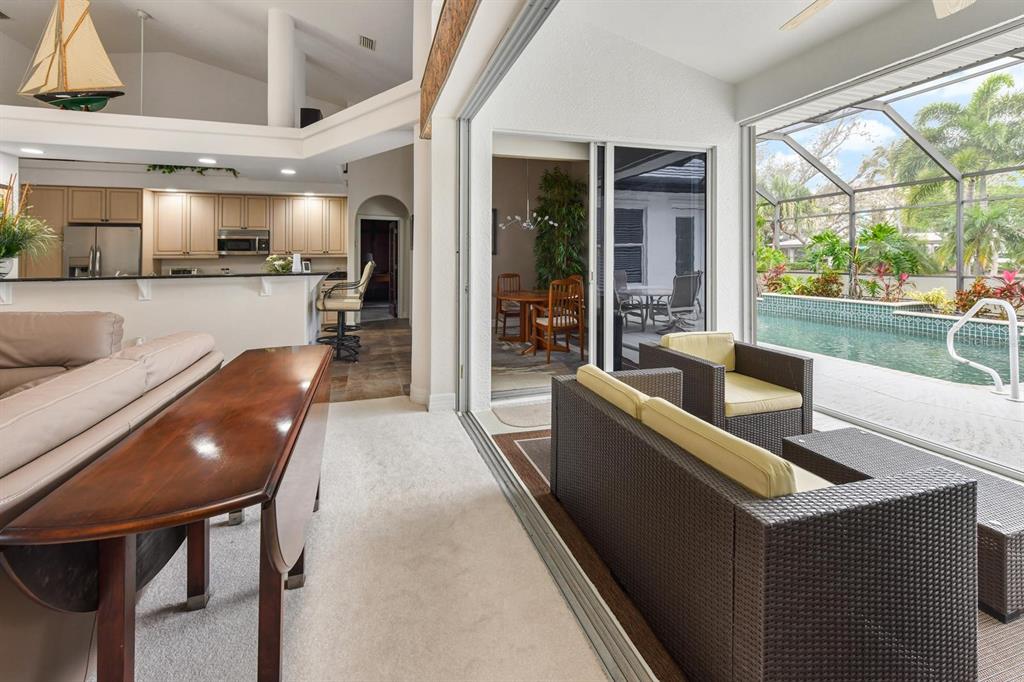 3267 Sugarloaf Key Road Punta Gorda, FL 33955 - Photo 24 of 83 a living room with furniture and a large window