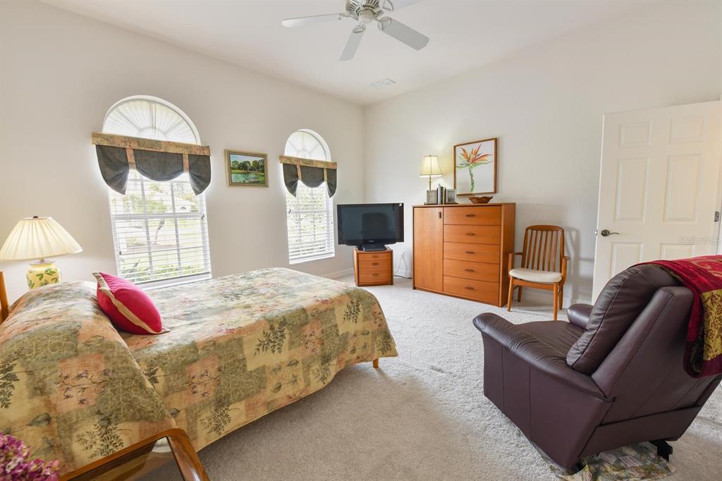 3267 Sugarloaf Key Road Punta Gorda, FL 33955 - Photo 50 of 83 a bedroom with a bed and wooden floor